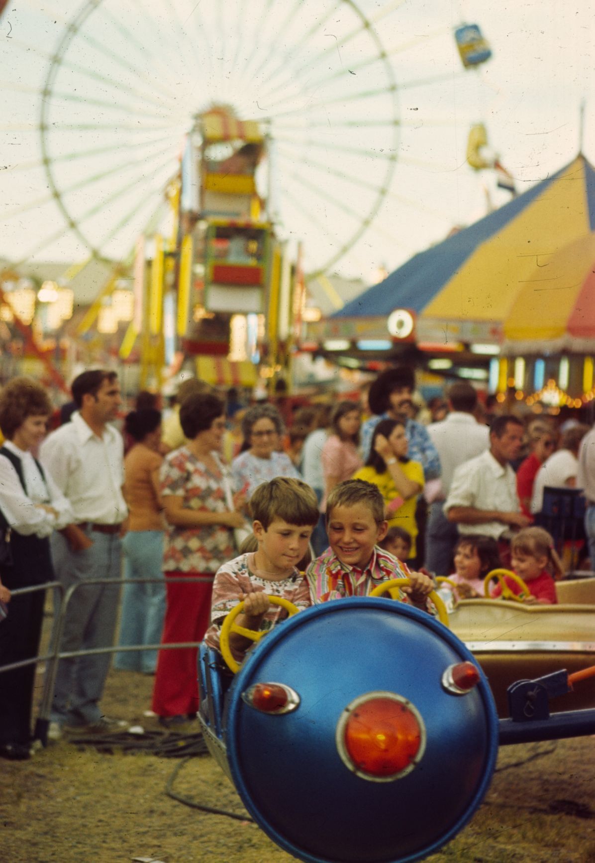 Boys on rocket ride, 1976